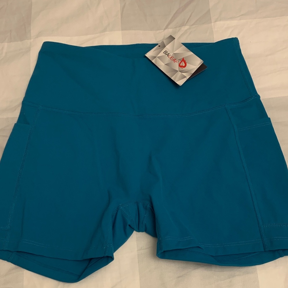 Baleaf Teal High-Rise Bike Shorts with 2 deep Side Pockets.